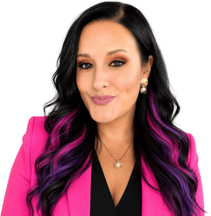 Angela Di Donna, smiling, in a magenta blazer, her long dark hair streaked with magenta and violet.